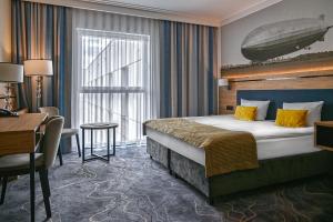 Łóżko lub łóżka w pokoju w obiekcie Sopotorium Hotel & Medical Spa