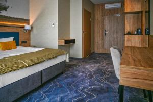 Łóżko lub łóżka w pokoju w obiekcie Sopotorium Hotel & Medical Spa