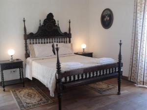 a bedroom with a large bed and two night stands at Historical 4 - Bedroom Villa in Alcobaca in Alcobaça