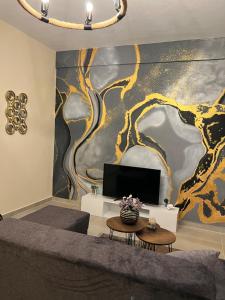 En TV eller et underholdningssystem på Dragoti Apartment 2
