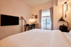 A bed or beds in a room at 安蘭居旅店 An Lan Jie Hotel