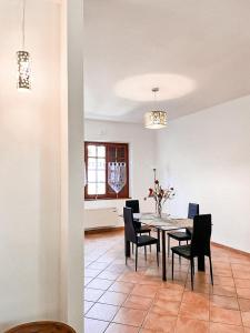 a dining room with a table and chairs at Villa delle Magnolie Montesilvano Abruzzo in Montesilvano