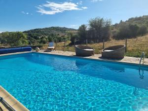 a swimming pool with a view of a mountain at Gîte de Navacelles in Blandas