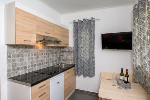 a kitchen with a sink and a counter top at Lakki Village in Aegiali