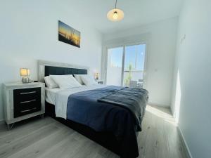 A bed or beds in a room at Villa Tranquilidad