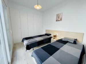 A bed or beds in a room at Villa Tranquilidad