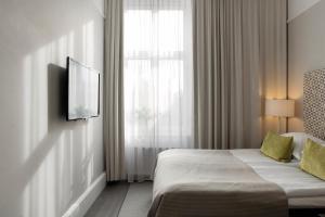 Letto o letti in una camera di Elite Grand Hotel Gävle