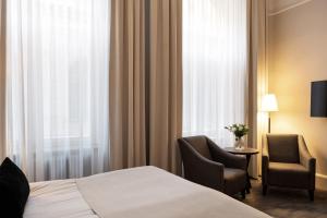 Letto o letti in una camera di Elite Grand Hotel Gävle