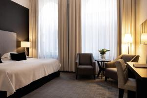 Letto o letti in una camera di Elite Grand Hotel Gävle
