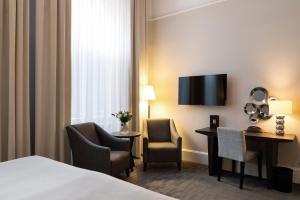 Letto o letti in una camera di Elite Grand Hotel Gävle