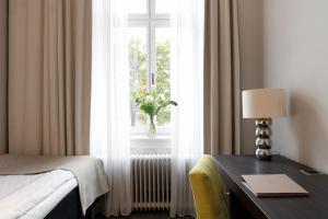 Letto o letti in una camera di Elite Grand Hotel Gävle