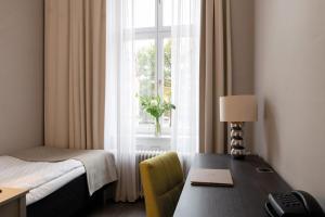 Letto o letti in una camera di Elite Grand Hotel Gävle