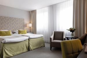 Letto o letti in una camera di Elite Grand Hotel Gävle