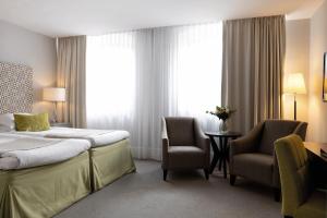 Letto o letti in una camera di Elite Grand Hotel Gävle