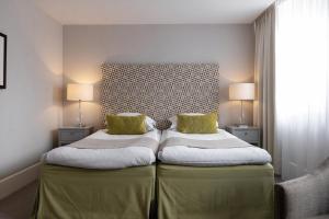 Letto o letti in una camera di Elite Grand Hotel Gävle