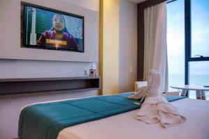 Postel nebo postele na pokoji v ubytování Hotel Água de Coco