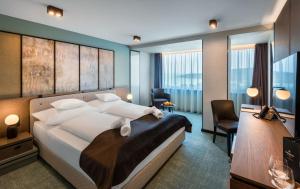 Posteľ alebo postele v izbe v ubytovaní Hunguest Hotel Bál Resort