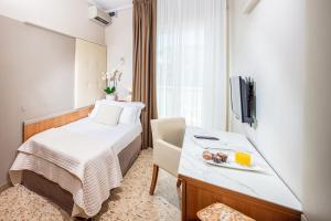 Posteľ alebo postele v izbe v ubytovaní Hotel Royal
