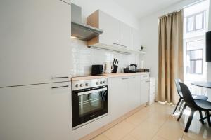 A kitchen or kitchenette at Modern and lovely apartment next to subway station