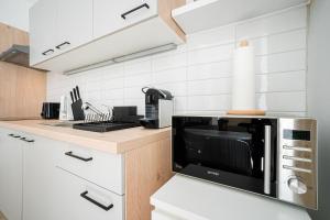 A kitchen or kitchenette at Modern and lovely apartment next to subway station