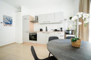 A kitchen or kitchenette at Modern and lovely apartment next to subway station