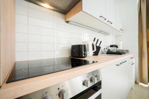 A kitchen or kitchenette at Modern and lovely apartment next to subway station