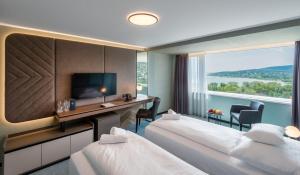 Posteľ alebo postele v izbe v ubytovaní Hunguest Hotel Bál Resort