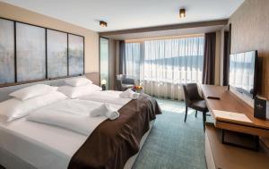 Posteľ alebo postele v izbe v ubytovaní Hunguest Hotel Bál Resort