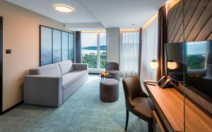 Televízia a/alebo spoločenská miestnosť v ubytovaní Hunguest Hotel Bál Resort