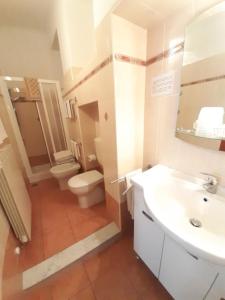 a bathroom with a toilet and a sink at Albergo in Centro in Turin