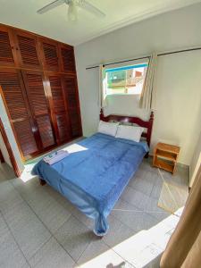 Vila Itanhaém客房内的一张或多张床位