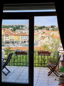a view of a balcony with a view of a city at Villa du Port in Port-Vendres