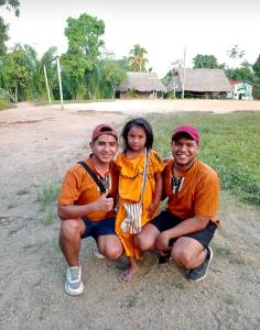 a group of three people posing for a picture at Victtorios Hotel in Satipo