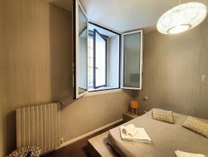 A bed or beds in a room at Residenza Porta Romana