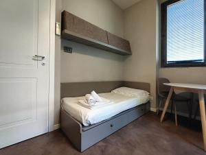 A bed or beds in a room at Residenza Porta Romana