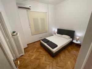 Postel nebo postele na pokoji v ubytování Parliament Place
