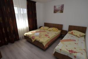 Postel nebo postele na pokoji v ubytování Casa Picu