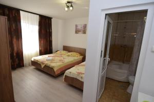 Postel nebo postele na pokoji v ubytování Casa Picu