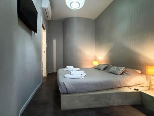 A bed or beds in a room at Residenza Porta Romana