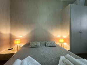 A bed or beds in a room at Residenza Porta Romana