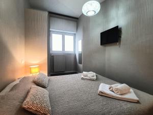 A bed or beds in a room at Residenza Porta Romana