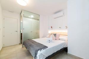 Postel nebo postele na pokoji v ubytování Suites Horno del Oro