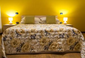 En eller flere senger på et rom på Borgo di Arcadia