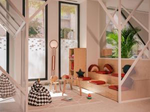 Habitación infantil con zona de juegos con cama en Ibis Styles Sevilla City Santa Justa, en Sevilla