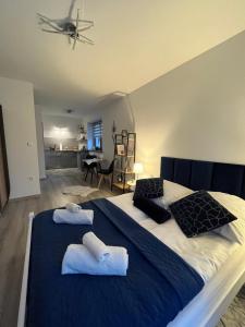 Posteľ alebo postele v izbe v ubytovaní Apartamenty Cichy Kącik