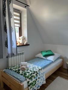 Posteľ alebo postele v izbe v ubytovaní Apartamenty Cichy Kącik