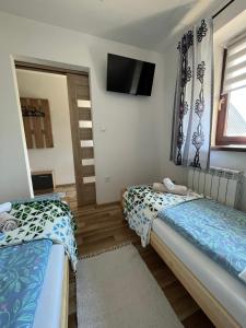 Posteľ alebo postele v izbe v ubytovaní Apartamenty Cichy Kącik