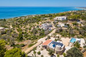 an aerial view of a house and the ocean at Villa Lodrea by Perle di Puglia in Morciano di Leuca
