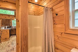 a shower curtain in a kitchen with wooden walls at Cozy Boone Cabin with Deck Close to Downtown! in Boone +17 photos