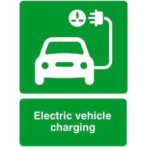a green sign with an electric vehicle charging symbol at Stansted Coach House in Elsenham